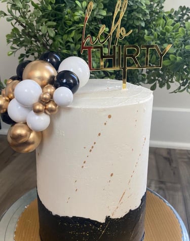 a cake with a hello kitty cake topperf