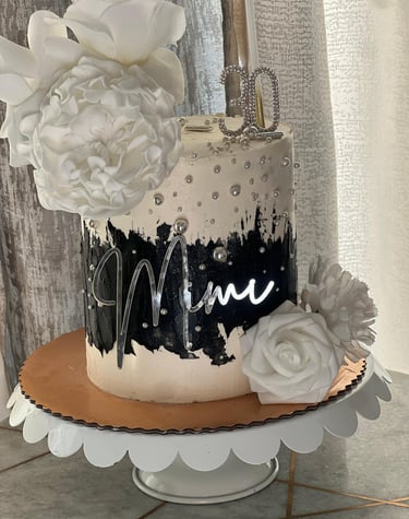 a cake with a cake topperf and flowers