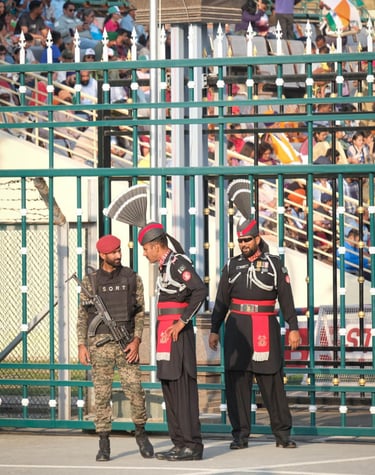 Three men in ceremonial uniforms standing proudly at Wagah Border, showcasing patriotism and nationa