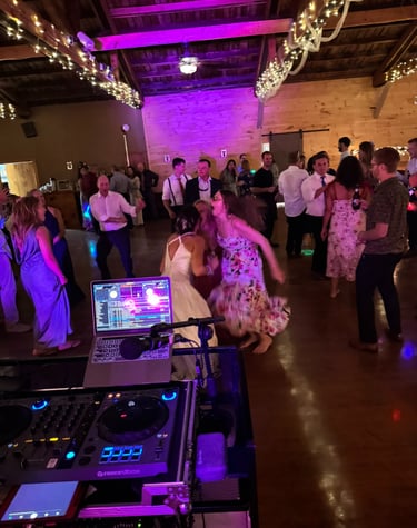 a woman in a dress and a dj booth