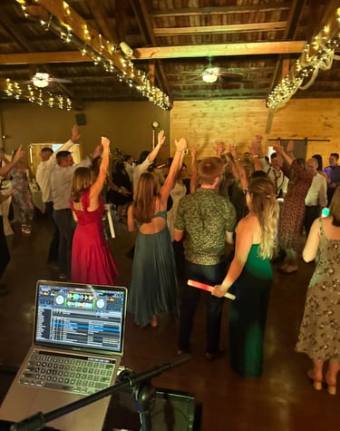 a group of people dancing at a party