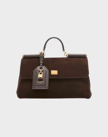 This My Sicily top handle bag from Dolce&Gabbana is crafted of soft suede and features a removable