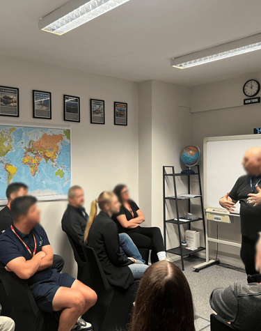 a group of people sitting in a room