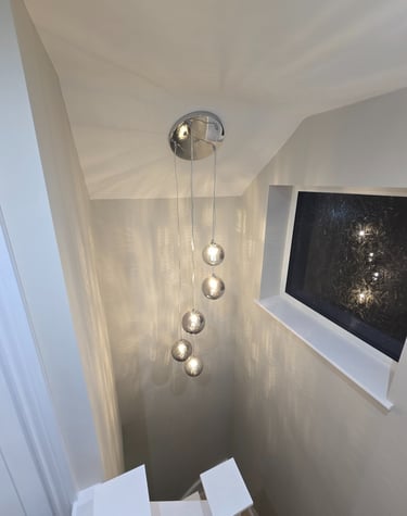 Hanging light in the stair well installed by Easy Spark Ltd in Bromley Kent