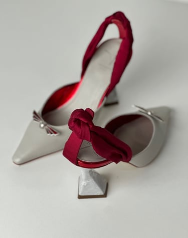 Judy Mazzotti pair of shoes with a bow tie on the side