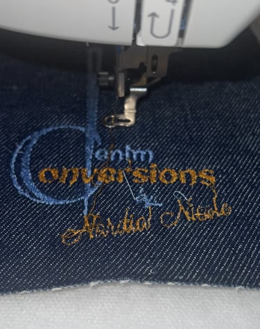 Denim Conversions denim handbag logo stitched on denim fabric
