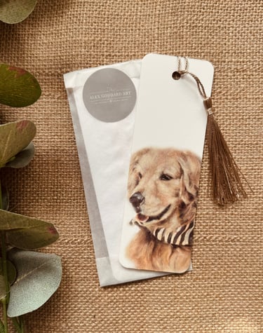 A bookmark feature a design of a golden retriever and finished with a coffee coloured tassel