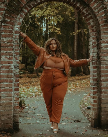 Latinx woman in a brown jacket and pants