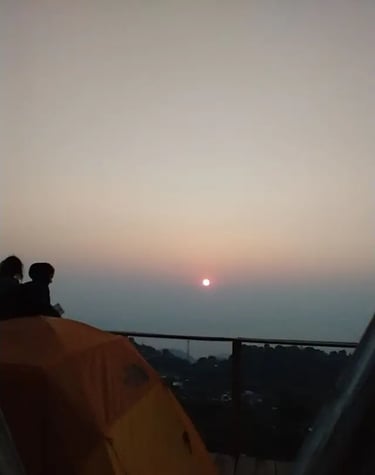 a person sitting on a tent with a tent