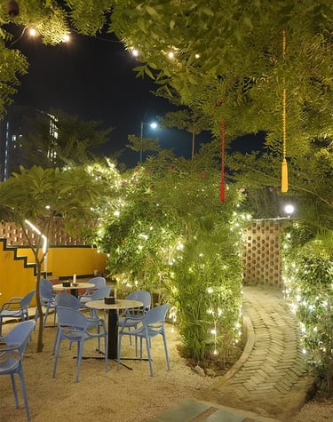 basil entry with a table and chairs and lights