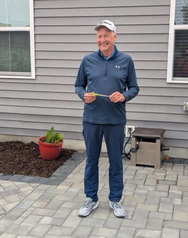 Jeff Paniati presenting the Mini-Guinea Trophy to himself for defending his title.