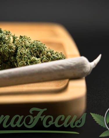 a marijuana leaf sitting on top of a wooden cutting board