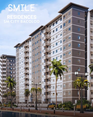 a large apartment building with palm trees and a smile on the side