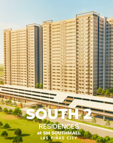 a large apartment complex with a train coming down the tracks