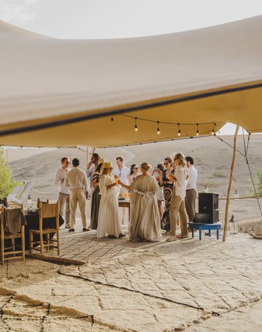 a group of people standing around a table