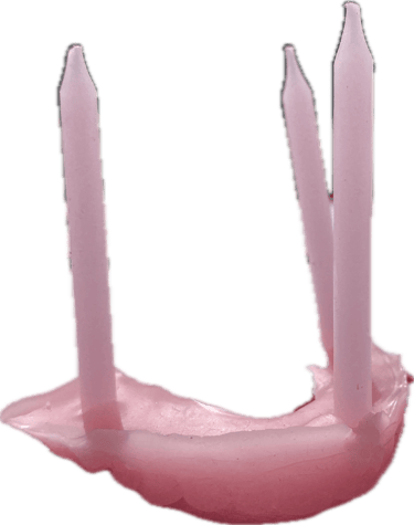 wax sculpture of teeth and birthday candles