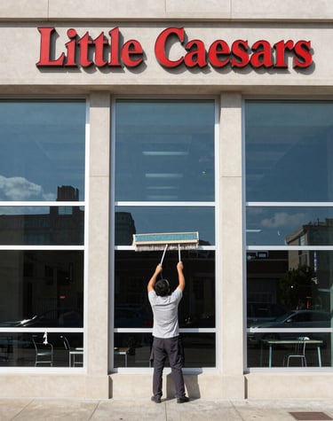 A freshly pressure-washed storefront gleaming under a clear sky in Auburn