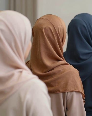 Close-up of a soft beige abaya fabric draped elegantly over a mannequin.