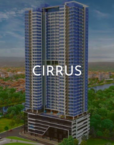 Modern blue high-rise Cirrus residential condominium building overlooking a lush urban landscape.