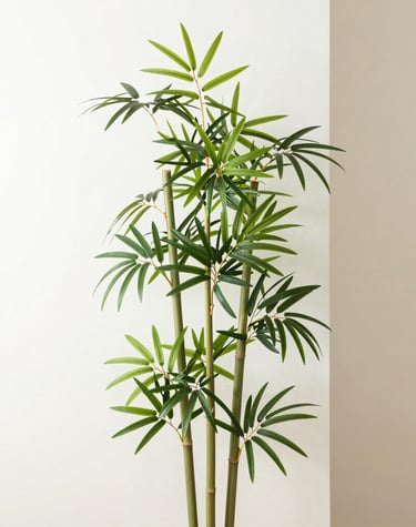A modern living room featuring a tall, lush artificial ficus tree in a minimalist white pot.