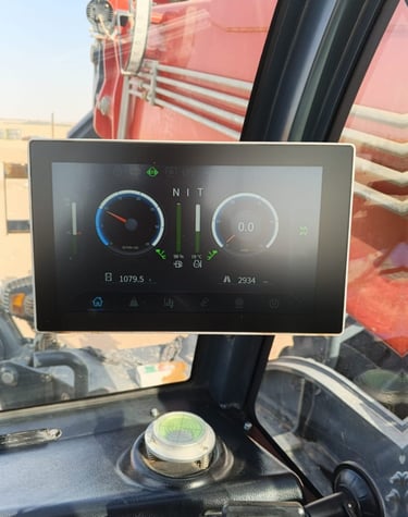 Digital dashboard display inside a forklift pwas camra cabin showing RPM, speed, and engine data.