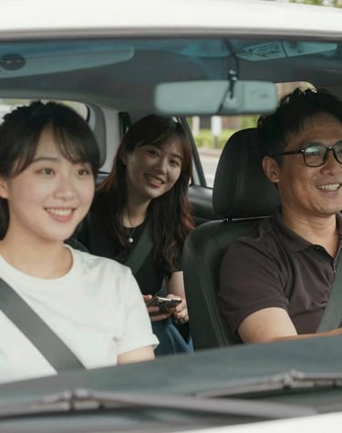 Professional driver greeting a smiling passenger near Fort Sill with a friendly wave.