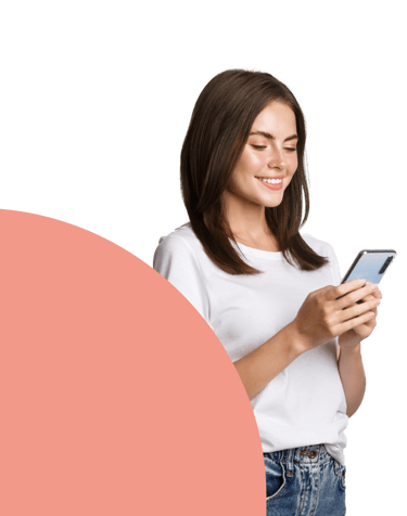 a woman in a white shirt and jeans jeans, holding a cell phone