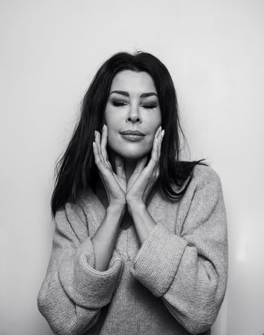 a woman with long hair and a sweater on