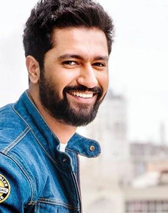 a man with a beard and a beard, smiling