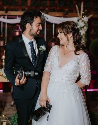 a man and woman standing in front of a wedding ceremony