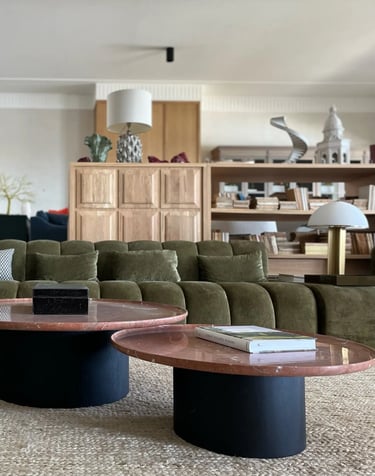 Lounge at Villa La Gratitud with curved sofas and contemporary finishes