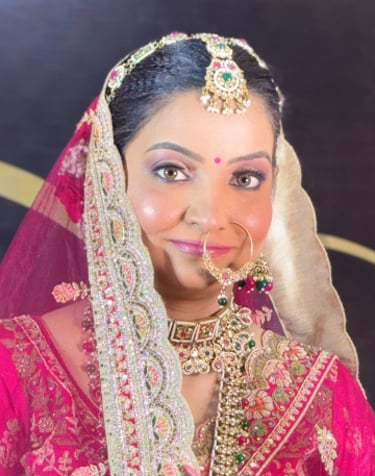 Indian bride in pink lehenga with HD bridal makeup, kundan jewelry, nath, and embellished dupatta — 