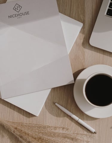 a laptop computer and a cup of coffee on a table
