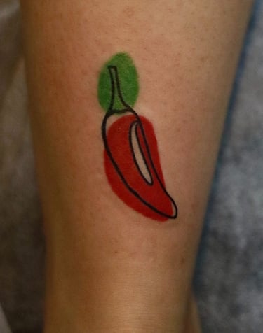 Abstract Red hot chilli tattoo with watercolor fill at Dudo's Tattoos Hyderabad