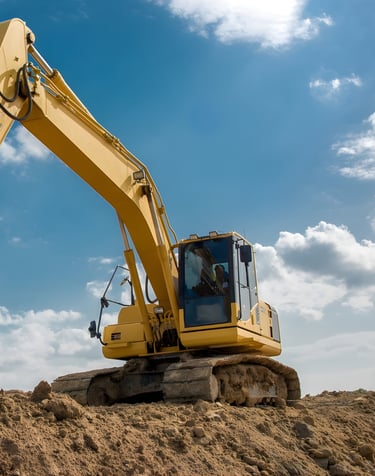 commercial sitework contractor excavator performing land clearing and grading Gulf South