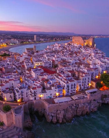 Peñiscola. a cityscape of a small town with a castle like structure