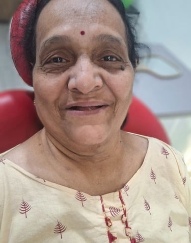  Happy dental patient smiling comfortably on dental chair at Shree Dental Care in Shyamal, Ahmedabad