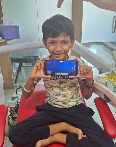 Relaxed patient sitting on dental chair during clinic visit at Shree Dental Care, Shyamal Ahmedabad
