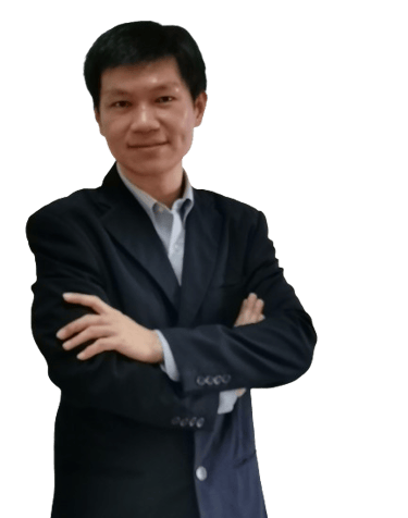 a man in a suit and tie standing in front of a computer