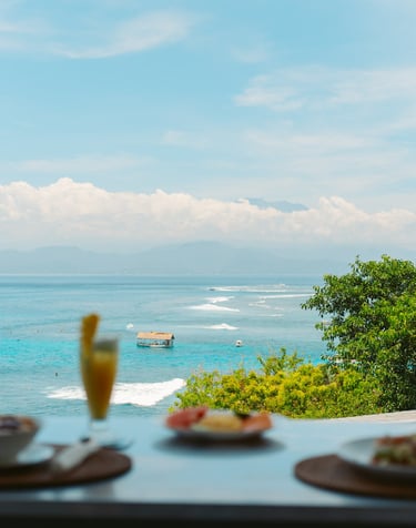two glasses of champagne and a glass of champagne on a table