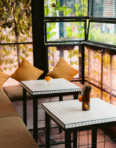 a table with two tables and a window