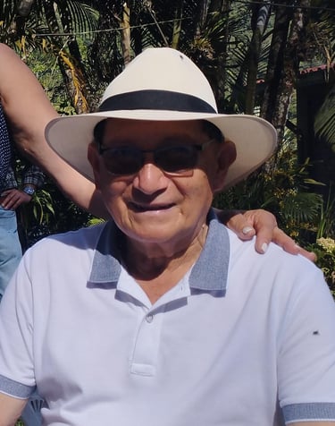 a man in a white shirt and a woman in a hat