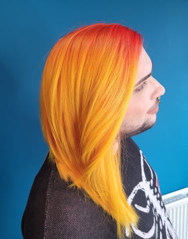 person with orange to yellow ombre hair