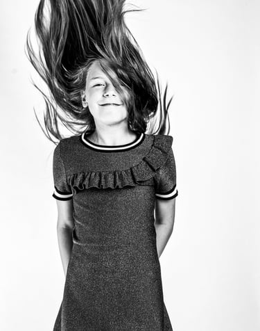 portret of a young girl with her hair in a dress