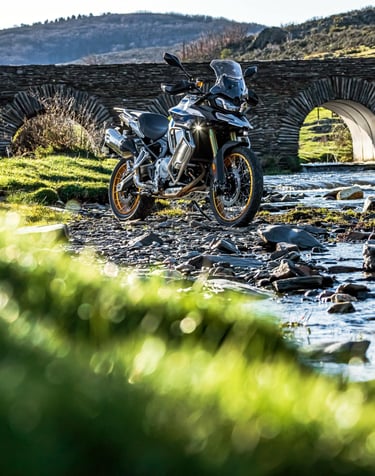 a person riding a motorcycle on a dirt road