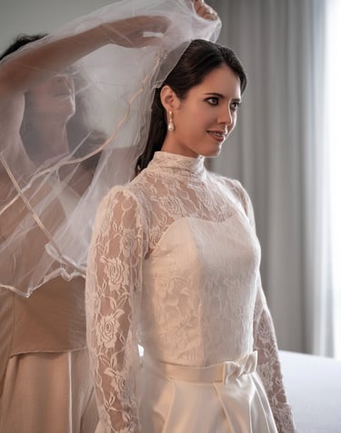 a bridesmaid in a wedding dress with a veil