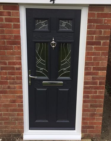 black composite door with chrome hardware and patterned glass fitted in hythe by buildmydoor