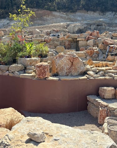 Natural pool with multiple levels, custom-colored walls & artisan stonework | Aqua Vitae build