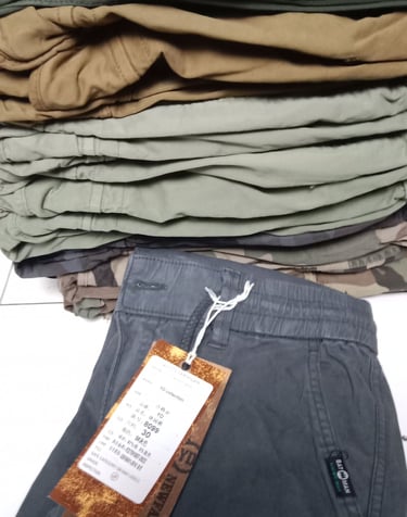 a pile of clothes and a tag tag on a table
