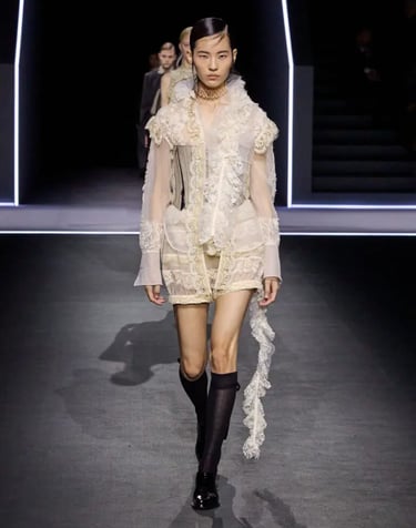 Sheer lace look with ruffles and corset.
